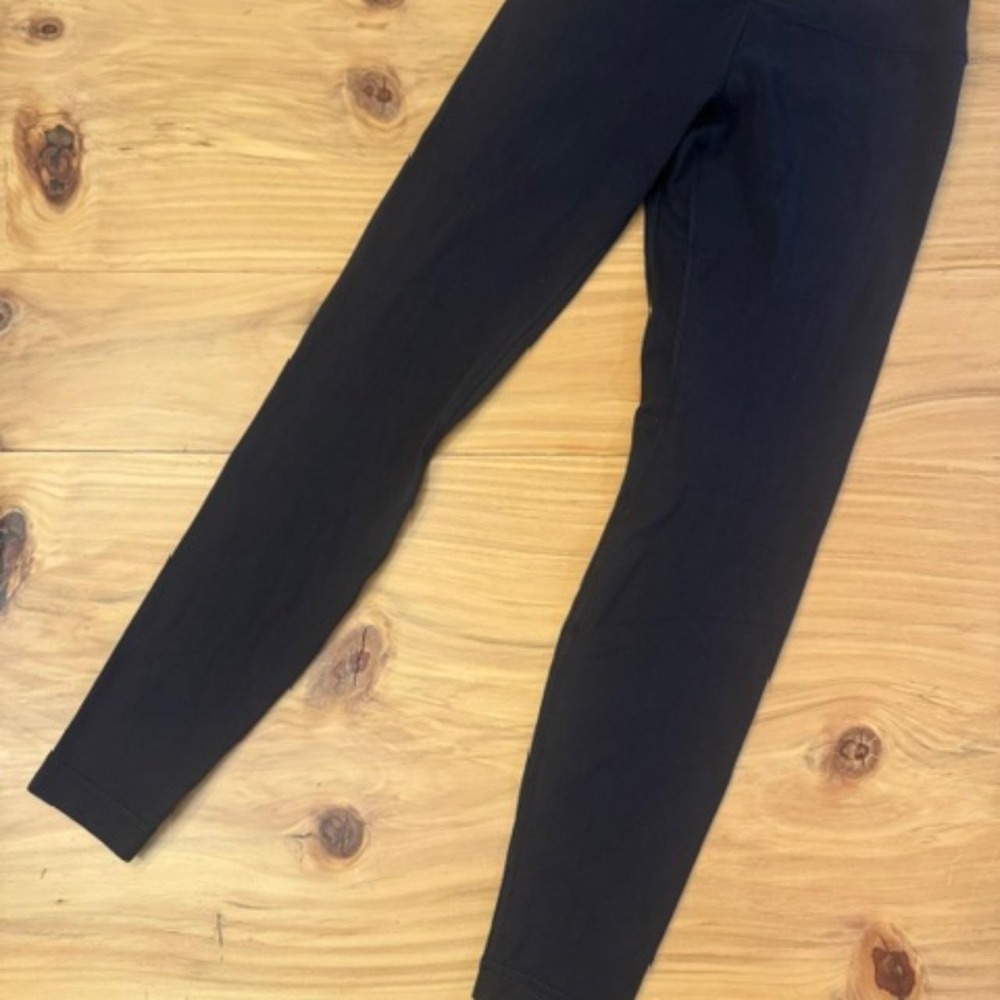 Unique Lululemon black full-length leggings (Size 8) featuring a metallic accent